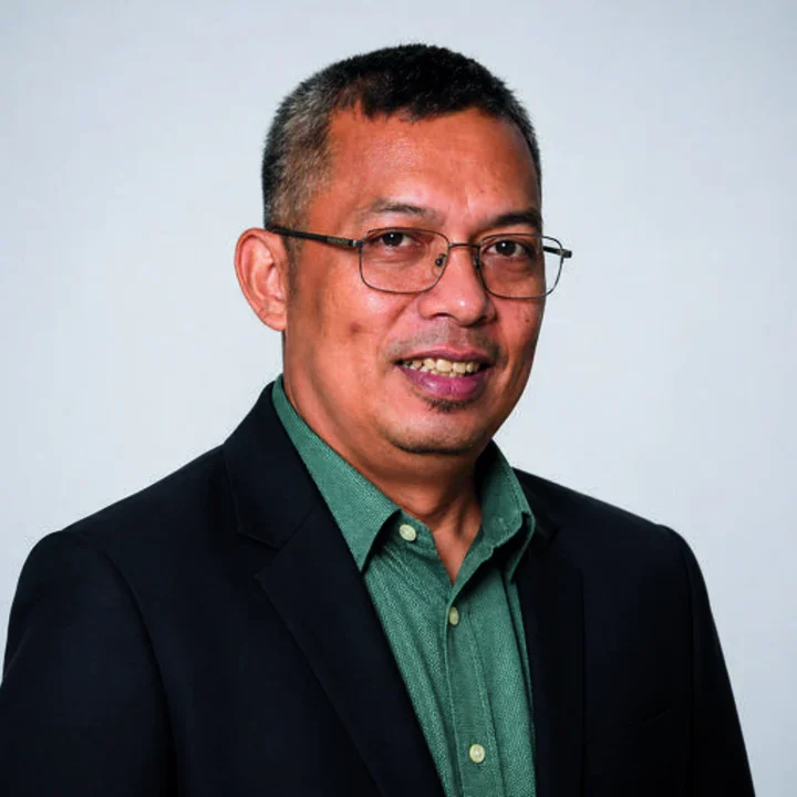 Portrait of Dr. Einstine Opiso